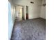 Open-concept room with neutral walls and flooring at 5709 Goldmount Ave, Las Vegas, NV 89107