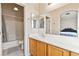 An ensuite bathroom that has a vanity, mirror, and shower at 5908 High Steed St # 102, Henderson, NV 89011