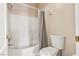 Bright bathroom featuring a white tub and shower combination with a neutral shower curtain at 5908 High Steed St # 102, Henderson, NV 89011