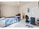 A bedroom with a bed and a door that leads to a bathroom at 5908 High Steed St # 102, Henderson, NV 89011