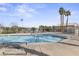 Community pool featuring a large pool with palm trees and landscaping at 5908 High Steed St # 102, Henderson, NV 89011