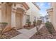 Inviting front entrance with stucco facade and well-maintained landscaping at 5908 High Steed St # 102, Henderson, NV 89011