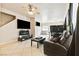 Open-concept living area with tile floors and large windows at 5908 High Steed St # 102, Henderson, NV 89011