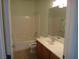 A bathroom featuring a shower-tub combo with tile surround and a vanity with a sink at 6143 Majestic Wind Ave, Las Vegas, NV 89122