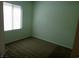 Cozy bedroom with natural light from window and neutral-toned carpeting at 6143 Majestic Wind Ave, Las Vegas, NV 89122