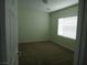 Cozy bedroom with neutral carpet and a bright window at 6143 Majestic Wind Ave, Las Vegas, NV 89122