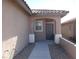 Inviting front entrance with a covered porch and desert landscaping at 6143 Majestic Wind Ave, Las Vegas, NV 89122