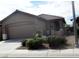 Charming single-story home with a well-manicured front yard and two car garage at 6143 Majestic Wind Ave, Las Vegas, NV 89122