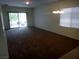 Inviting living room featuring a sliding glass door and plush carpeting at 6143 Majestic Wind Ave, Las Vegas, NV 89122