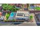 Aerial view featuring the pool, solar panels, landscaping, and the unique architectural design at 6325 Carmel Creek Ave, Las Vegas, NV 89139