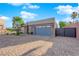 Modern home featuring a driveway paved with decorative brick and a blue garage door at 6325 Carmel Creek Ave, Las Vegas, NV 89139