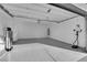 Spacious garage with epoxy flooring, ready for parking and storage solutions at 6325 Carmel Creek Ave, Las Vegas, NV 89139
