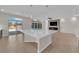 Kitchen island, stainless steel appliances, backyard pool views, and open-concept design for modern living at 6325 Carmel Creek Ave, Las Vegas, NV 89139