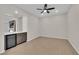Open living room with wood-look flooring, recessed lighting, and a convenient beverage center at 6325 Carmel Creek Ave, Las Vegas, NV 89139