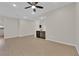 Bright and airy living room with recessed lighting, wood-look flooring, and a beverage center at 6325 Carmel Creek Ave, Las Vegas, NV 89139