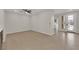 Open-concept living area with tiled flooring, a ceiling fan, and lots of natural light at 6325 Carmel Creek Ave, Las Vegas, NV 89139