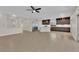 Spacious, light-filled room featuring modern cabinets, stainless appliances, and expansive neutral-toned tile flooring at 6325 Carmel Creek Ave, Las Vegas, NV 89139