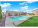 Backyard pool featuring a shallow tanning ledge perfect for relaxing on a sunny day at 6325 Carmel Creek Ave, Las Vegas, NV 89139