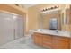 Bright bathroom with white tile, shower, double sinks, and updated vanity at 6701 Dorita Ave # 202, Las Vegas, NV 89108