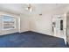 Bedroom with neutral paint, a ceiling fan, plush carpets and a large window at 6701 Dorita Ave # 202, Las Vegas, NV 89108