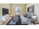 Modern bedroom with sleek furniture, a large window, and minimalist decor for a clean look at 6701 Dorita Ave # 202, Las Vegas, NV 89108