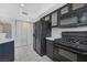 This kitchen features ample cabinet space, appliances, and white tile floors at 6701 Dorita Ave # 202, Las Vegas, NV 89108
