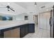 Bright kitchen offers white countertops, stainless steel dishwasher and white tile flooring at 6701 Dorita Ave # 202, Las Vegas, NV 89108