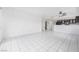 Spacious living area with white tile floors, ceiling fan and neutral paint at 6701 Dorita Ave # 202, Las Vegas, NV 89108