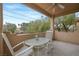 Cozy covered patio with comfortable rocking chairs, perfect for enjoying the outdoor views at 6701 Dorita Ave # 202, Las Vegas, NV 89108