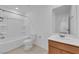 A well-lit bathroom featuring a bath tub, toilet, vanity, and tile flooring at 7022 Feather Hill St, North Las Vegas, NV 89086