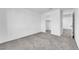 Bedroom features plush carpeting, a walk-in closet, and neutral walls at 7022 Feather Hill St, North Las Vegas, NV 89086