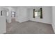 Neutral bedroom with carpet flooring, natural light, and a view to the outside at 7022 Feather Hill St, North Las Vegas, NV 89086