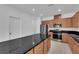 Modern kitchen boasts stainless steel appliances, granite countertops, and ample storage space at 7022 Feather Hill St, North Las Vegas, NV 89086