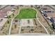 Aerial view of the neighborhood park with playground, picnic tables and open green space at 7022 Feather Hill St, North Las Vegas, NV 89086