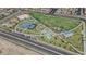 Aerial view of the neighborhood park with basketball court, playground, and open green space at 7022 Feather Hill St, North Las Vegas, NV 89086