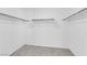 Walk-in closet with carpet and shelving at 7022 Feather Hill St, North Las Vegas, NV 89086