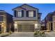 Charming two-story home with a well-maintained front yard at 7061 Tilligerry St, North Las Vegas, NV 89084