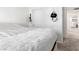 Cozy bedroom with neutral tones, a sliding door closet, and comfortable bedding at 715 Pickled Pepper Pl, Henderson, NV 89011