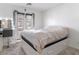 Inviting bedroom featuring a private door to the outdoors, natural light, and vanity at 715 Pickled Pepper Pl, Henderson, NV 89011