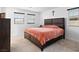 Comfortable main bedroom featuring a large bed, soft carpet, and natural light at 715 Pickled Pepper Pl, Henderson, NV 89011