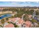 Aerial view of neighborhood, golf course, and skyline at 7566 Spanish Bay Dr, Las Vegas, NV 89113