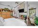 Spacious primary bedroom featuring a cozy fireplace, walkout to private lanai, and ample space at 7889 Harbour Towne Ave, Las Vegas, NV 89113