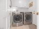 A practical laundry room is equipped with modern washer and dryer units, ensuring efficient laundry care at 7889 Harbour Towne Ave, Las Vegas, NV 89113