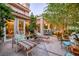 Relaxing outdoor patio with comfortable lounge chairs and lush greenery at 7889 Harbour Towne Ave, Las Vegas, NV 89113