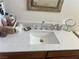 Bathroom featuring a modern white sink with a dark wood cabinet and chrome faucet at 8396 Yamhill St, Las Vegas, NV 89123