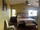 Bedroom featuring a high ceiling, a patterned bedspread, and carpet at 8396 Yamhill St, Las Vegas, NV 89123