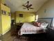 Bedroom featuring a patterned bedspread, wood floors, and seating area at 8396 Yamhill St, Las Vegas, NV 89123