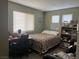 Bedroom featuring neutral-colored walls, carpeted floor, and a work desk area at 8396 Yamhill St, Las Vegas, NV 89123