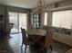 Bright dining area with woven chairs and view of the back patio at 8396 Yamhill St, Las Vegas, NV 89123