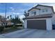 Charming two-story home with a well-maintained lawn and a two-car garage in a residential neighborhood at 8396 Yamhill St, Las Vegas, NV 89123